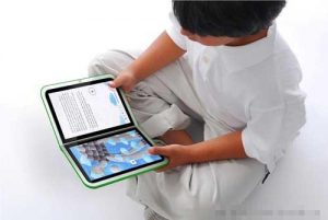 A Young Boy Reading A Book From Online Book Store